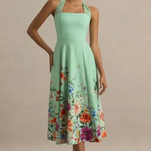Auburn | Vestido midi con escote halter en verde menta con detalle de flores en el bajo