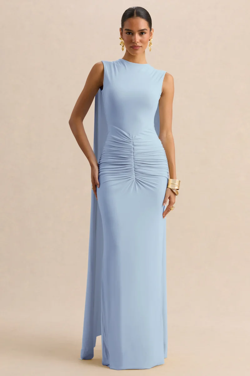 Premiere | Vestido Largo Azul Empolvado De Jersey Elástico Con Escote Barco Y Mangas Capa - Imagen 7