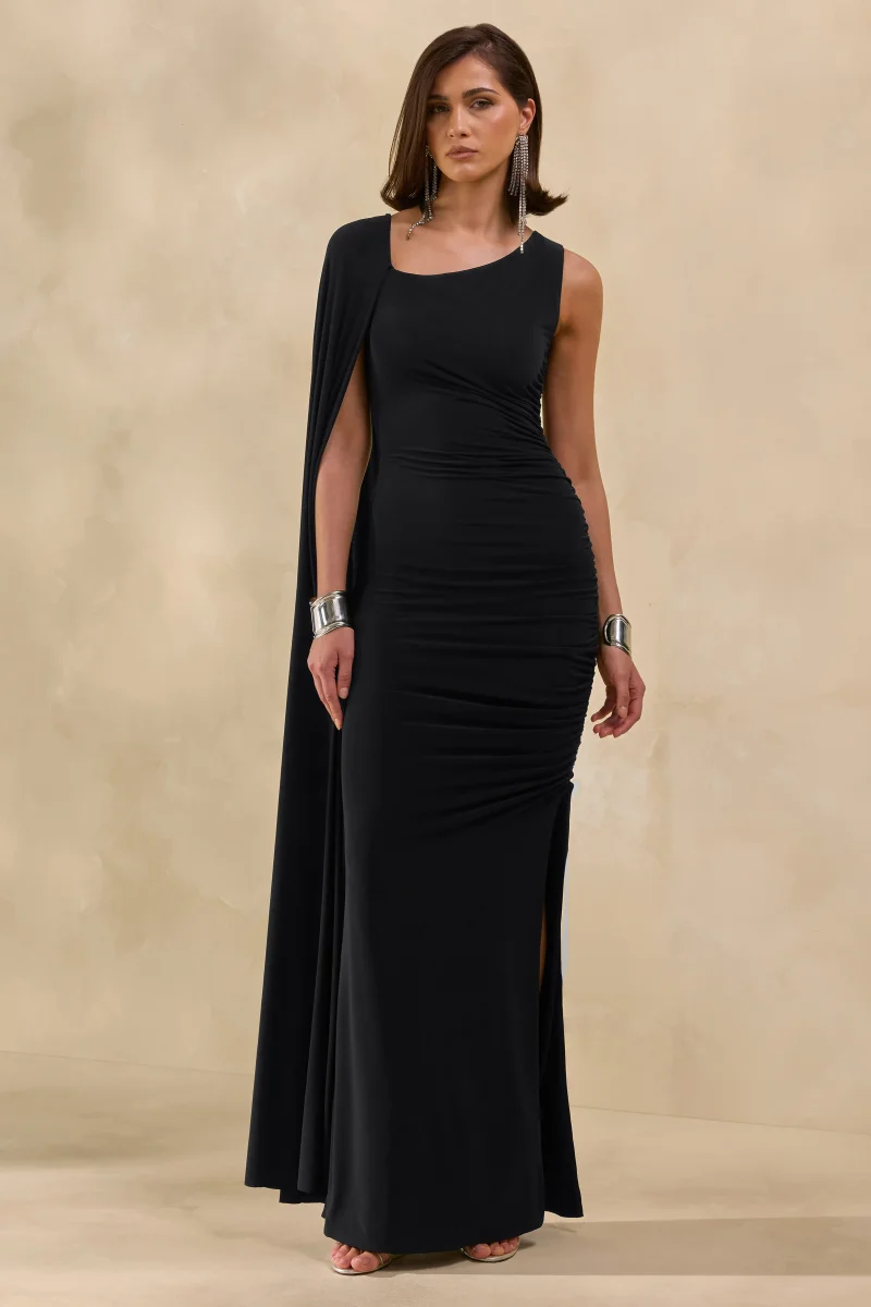 Evalette | Vestido Largo Negro De Jersey Con Cuello Asimétrico Y Manga Capa - Imagen 6