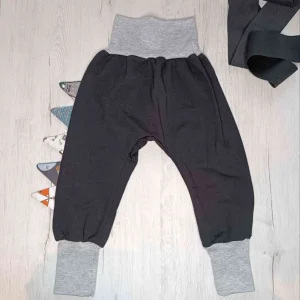 Pantalones negros evolutivos escamas de dragón