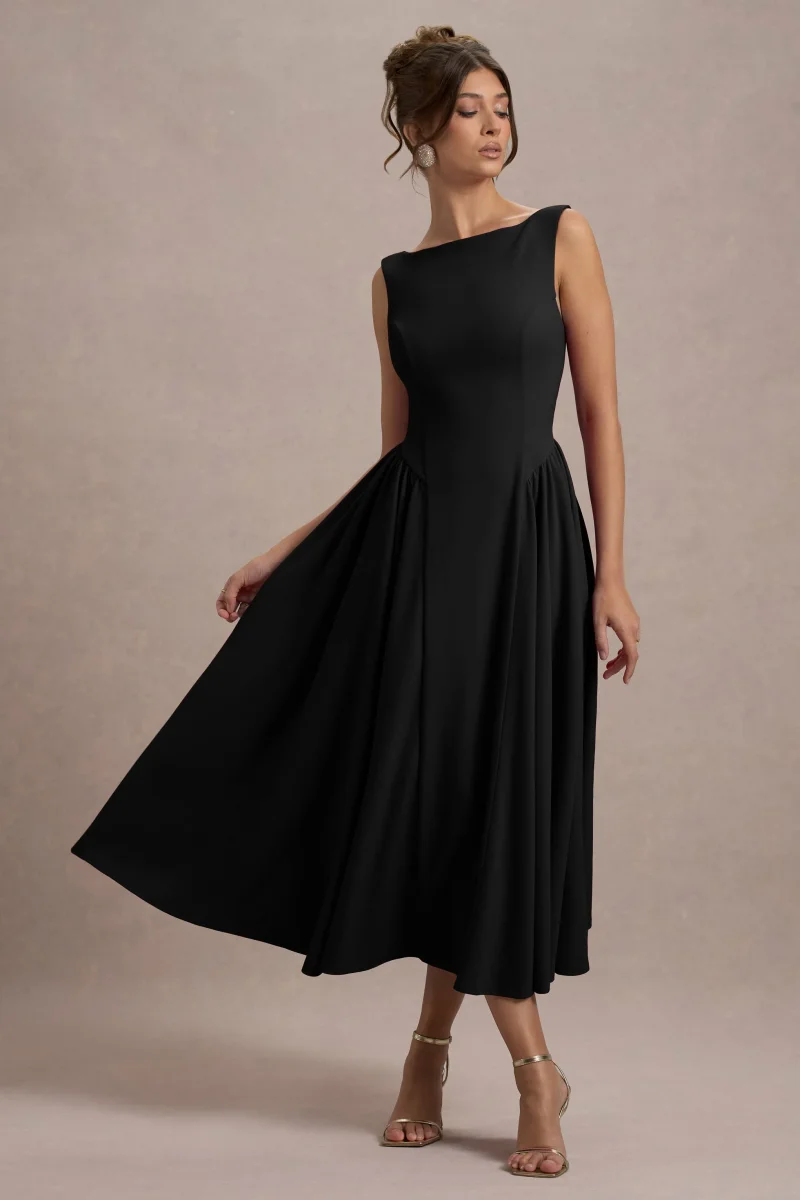 Muriel | Vestido midi negro con escote barco y bajo con volumen