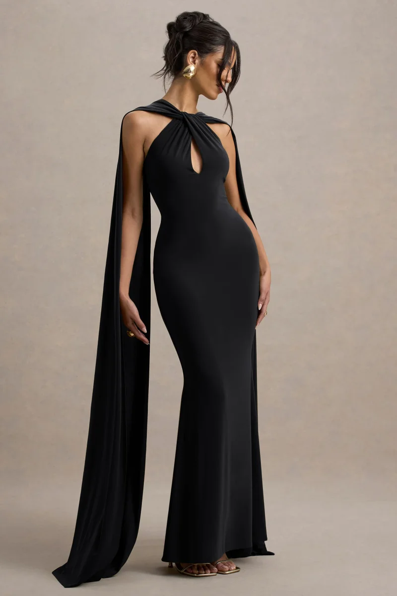 Rhoda | Vestido largo negro con escote halter torcido y capa - Imagen 2