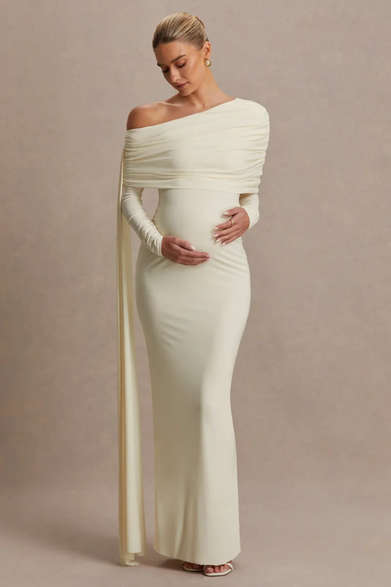 Cyra | Vestido largo crema con escote asimétrico y fajín