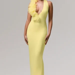 Harriet | Vestido largo amarillo con escote pronunciado y detalle floral lateral