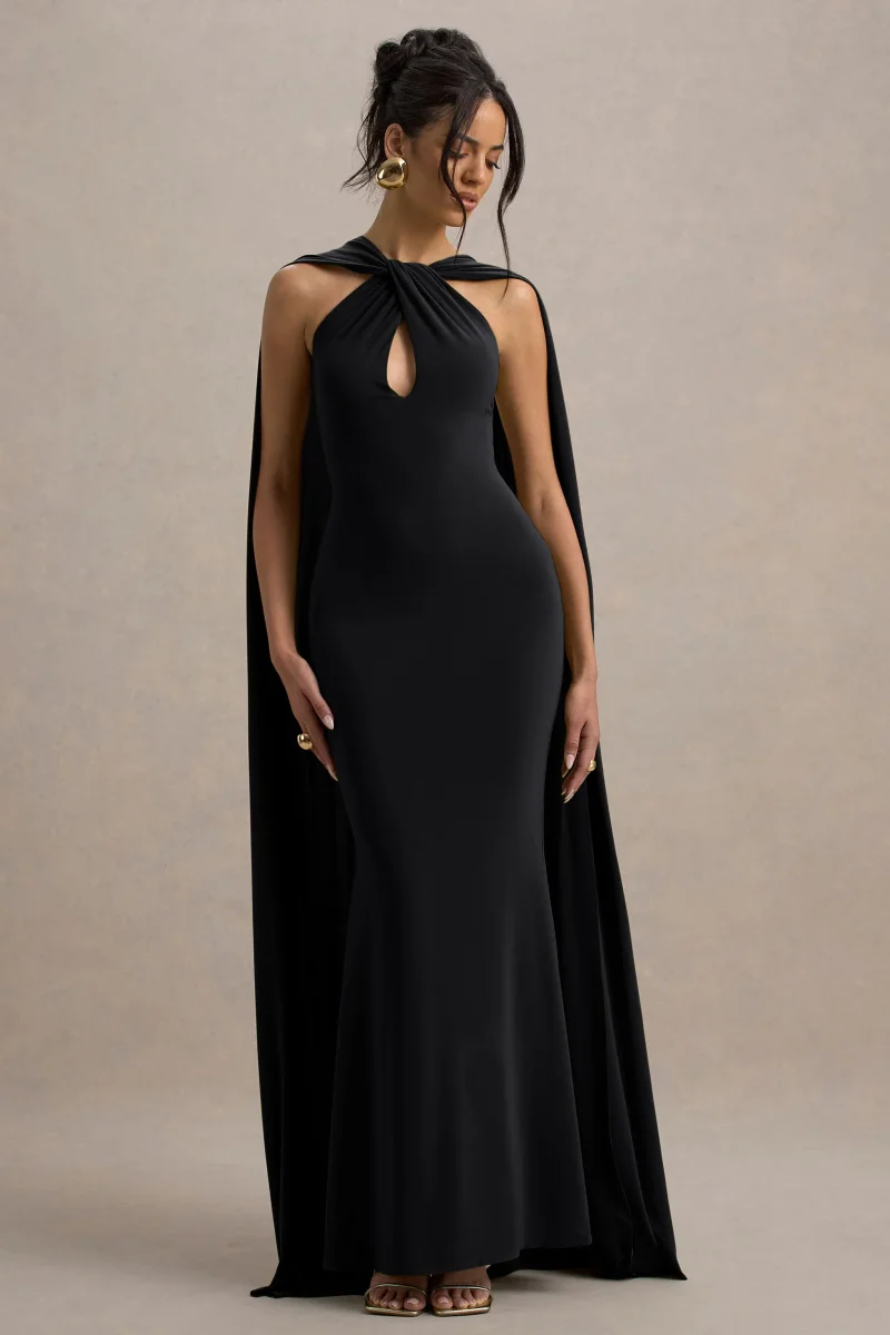 Rhoda | Vestido largo negro con escote halter torcido y capa - Imagen 5