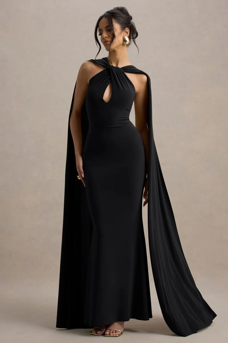 Rhoda | Vestido largo negro con escote halter torcido y capa - Imagen 6