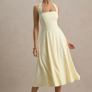 Auburn | Vestido midi amarillo pastel con escote halter de malla con lazo