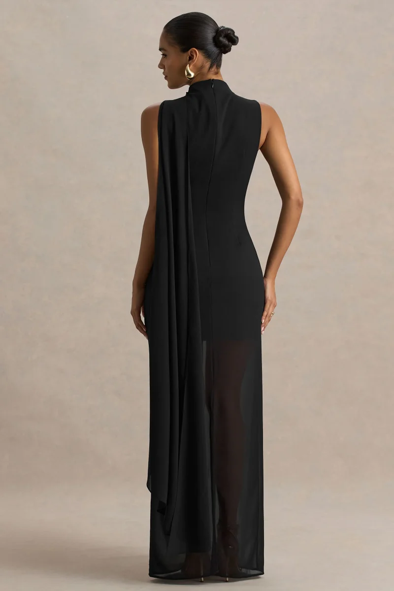 Unpredictable | Vestido Largo Negro con Escote Alto y Detalle de Capa en la Espalda - Imagen 3